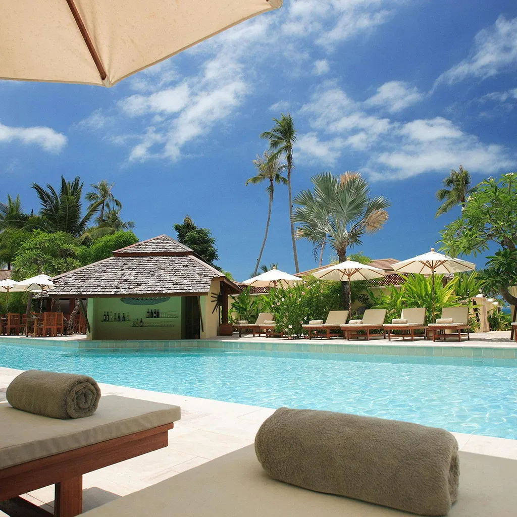 Tropical location with a blue pool of water.